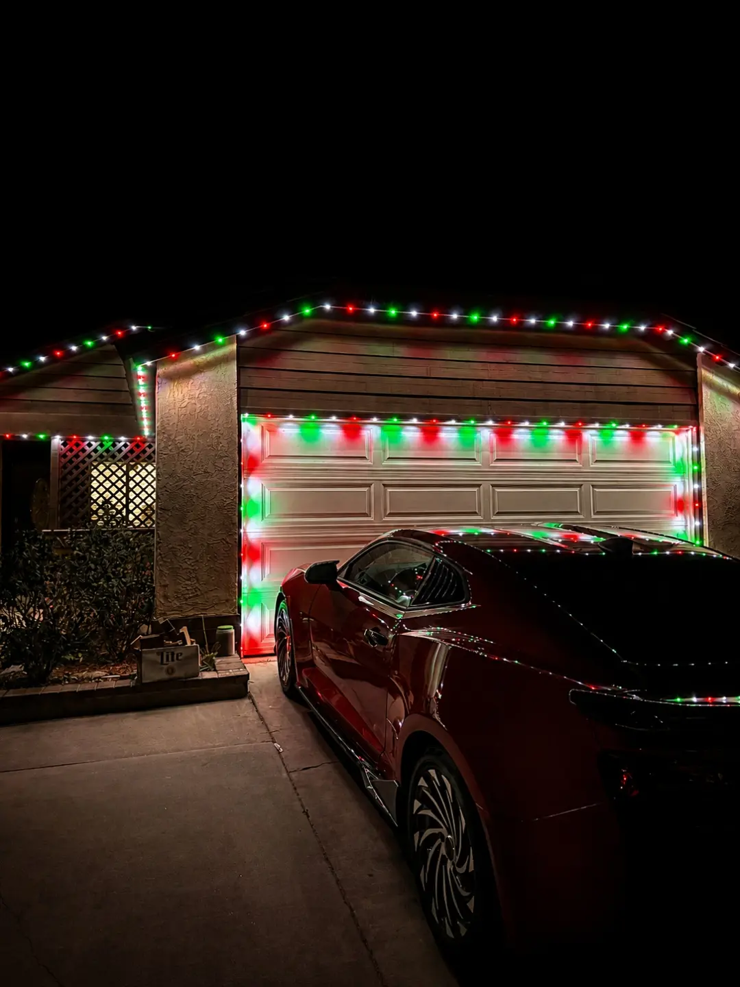 Permanent roofline lights displaying holiday colors