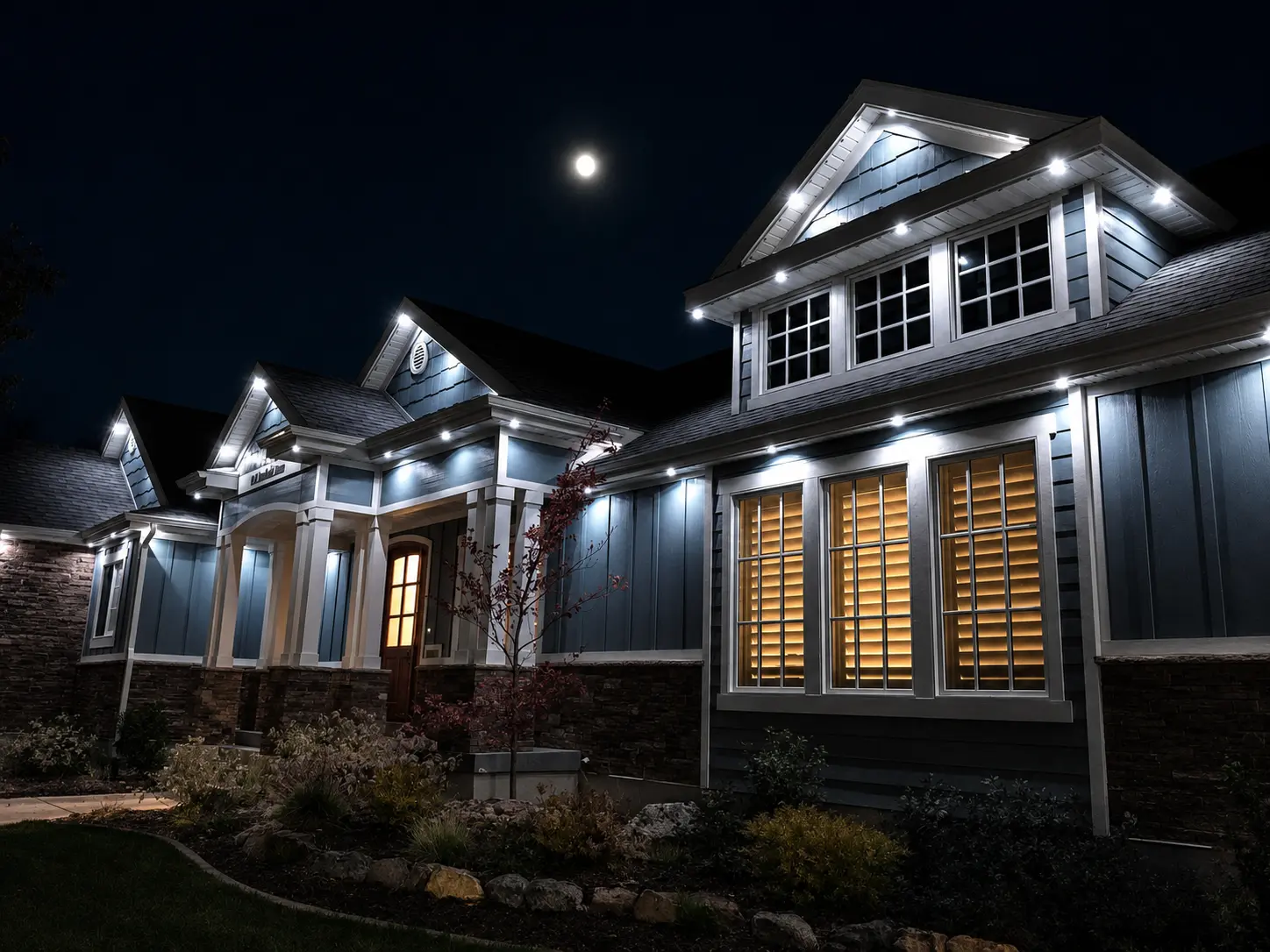 Warm white permanent lighting outlining a Florida home roofline