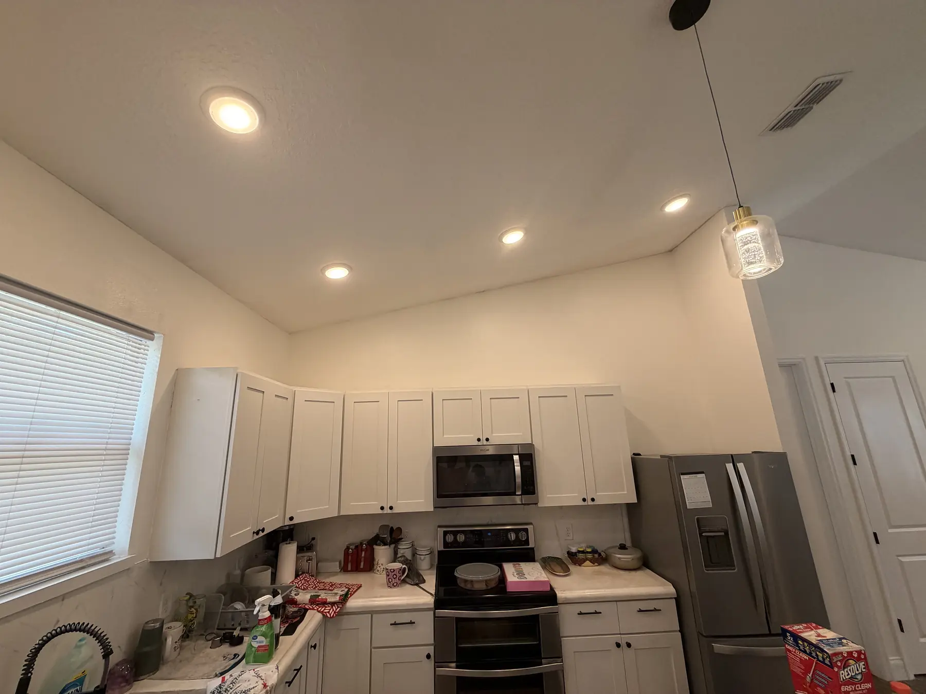 Kitchen with freshly painted walls and ceiling above white cabinetry